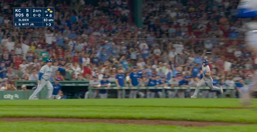 Vance Wilson signals to Nick Loftin to stop running and return to third.