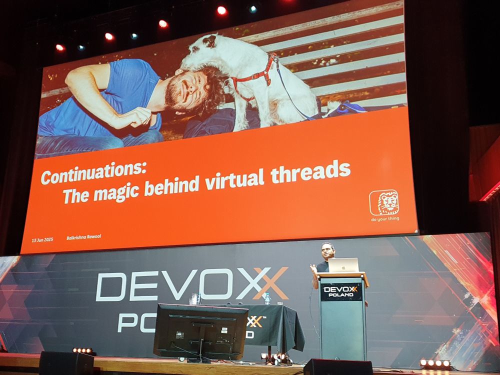Balkrisna Rawool on stage at Devoxx Poland. The slide behind him has the talk title "Continuations: The magic behind virtual threads".