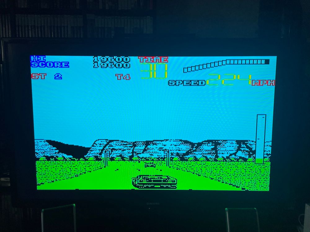 Chase HQ II on the ZX Spectrum, showing your car (which looks crap), another car in the middle distance (which looks crap), some lamp-posts (which look crap), and some mountains in the distance (which look crap).
Not pictured is the music, which is crap.