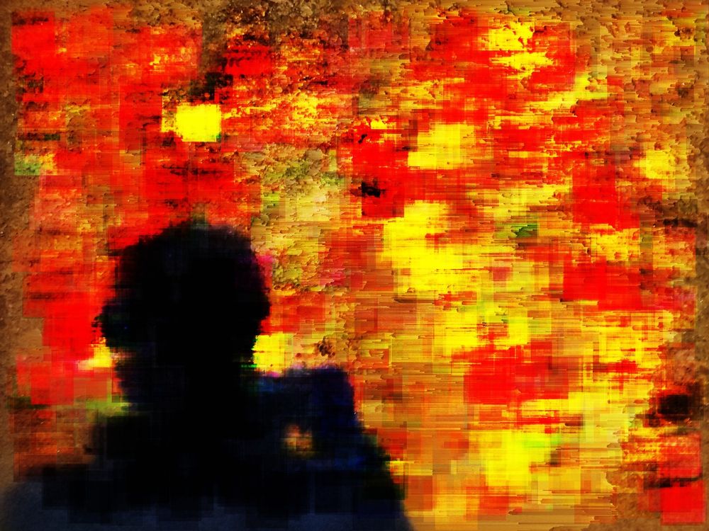 Photo of the shadow of a person on a wall.