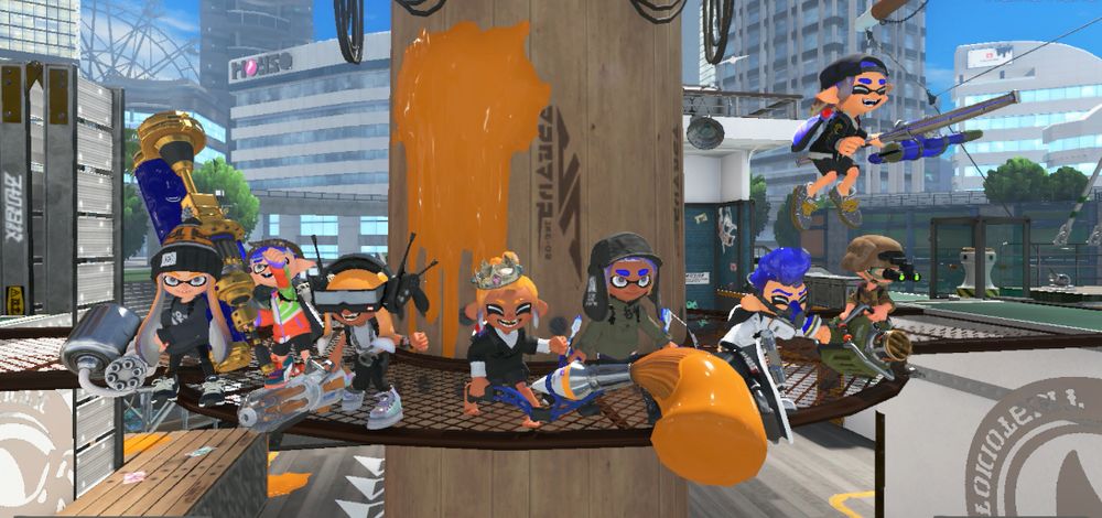 A group of blue and orange Inklings and Octolings gathered on a ship's mast.