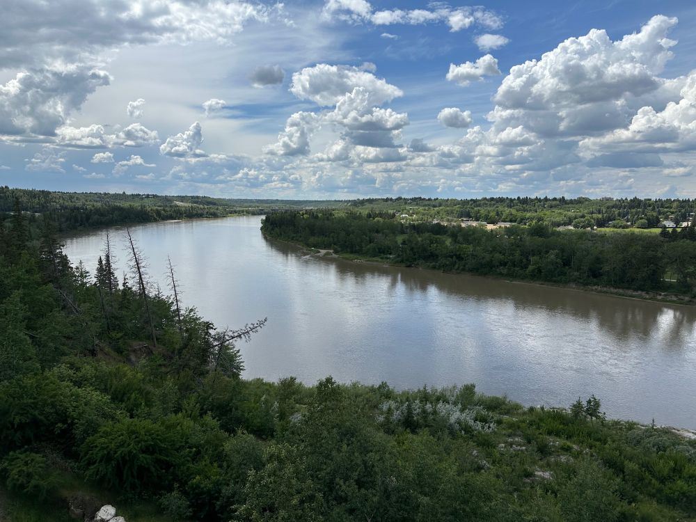 Looking south from Keillor Lookout towards the Quesnell Bridge. The River Valley is lush and the river is running high. 