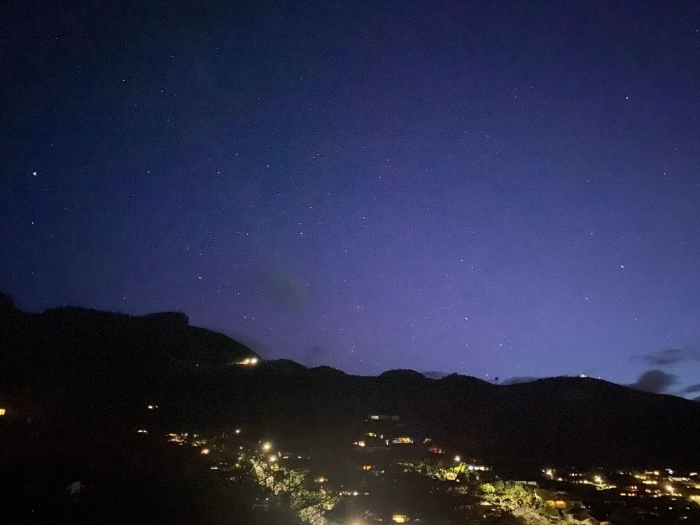 Faint pink Aurora in evening sky. 