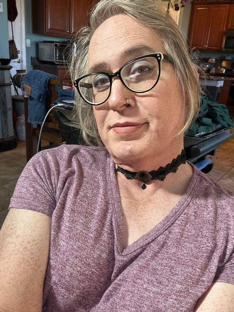 Selfie of me with Victorian lace black choker with stone in center front.
