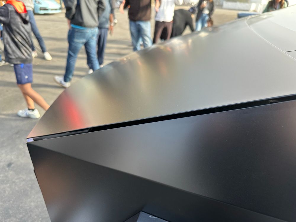 Just a bad hood seam, which is almost refreshing in that at least it's a relatively even bad seam. It's just way wider than it should be, which in fairness is actually one of Tesla's signature brand looks. It's actually pretty rare to see a Tesla whose hood doesn't have some kind of fitment issues, but here it's more obvious because of those uncompromisingly straight lines. At least the matte wrap helps with most of the oilcanning and other surfacing issues, at least until it gets covered in bird shit and other unwashable detritus, at which point it will go back to looking as crap as every other Cybertruck.