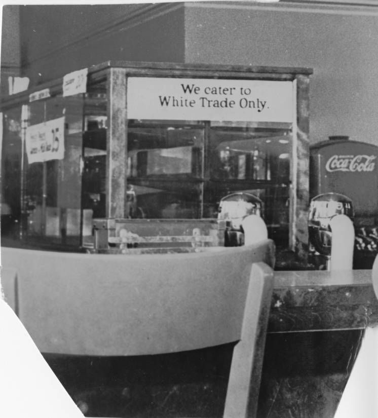 Lunch counter with sign that reads "We cater to White Trade Only"