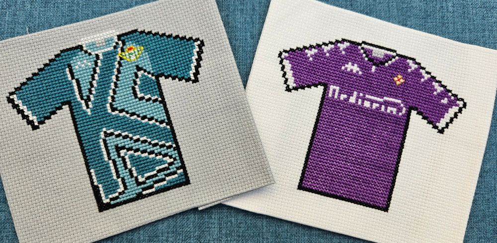 Cross stitch versions of Real Betis (teal, with a very large darker teal "K", with black and white trim) and Fiorentina (violet, with white cuffs, collar and sponsor logo)