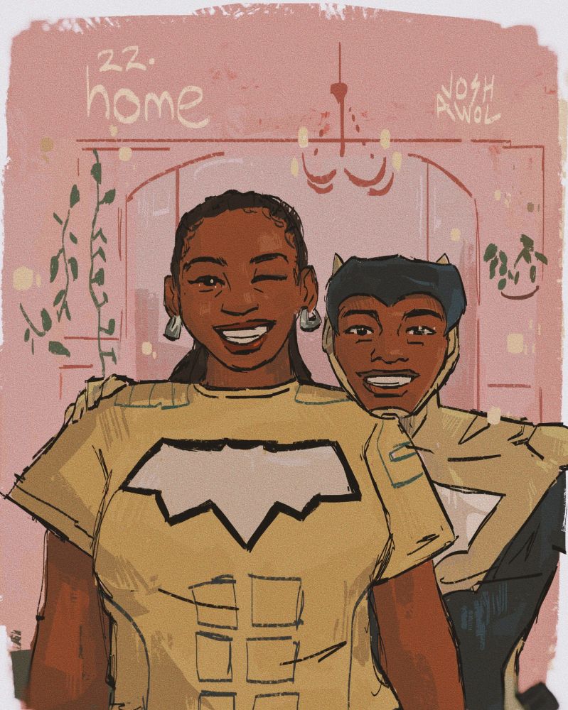 duke and his mama smiling big. his mum is wearing a tee with Duke's bat symbol on it.