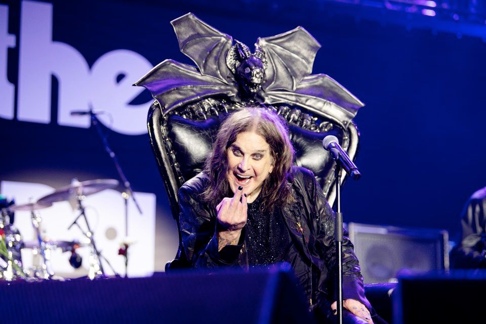 Ozzy Osbourne giving it finger @ his final concert.  Photographer: Ross Halfin.