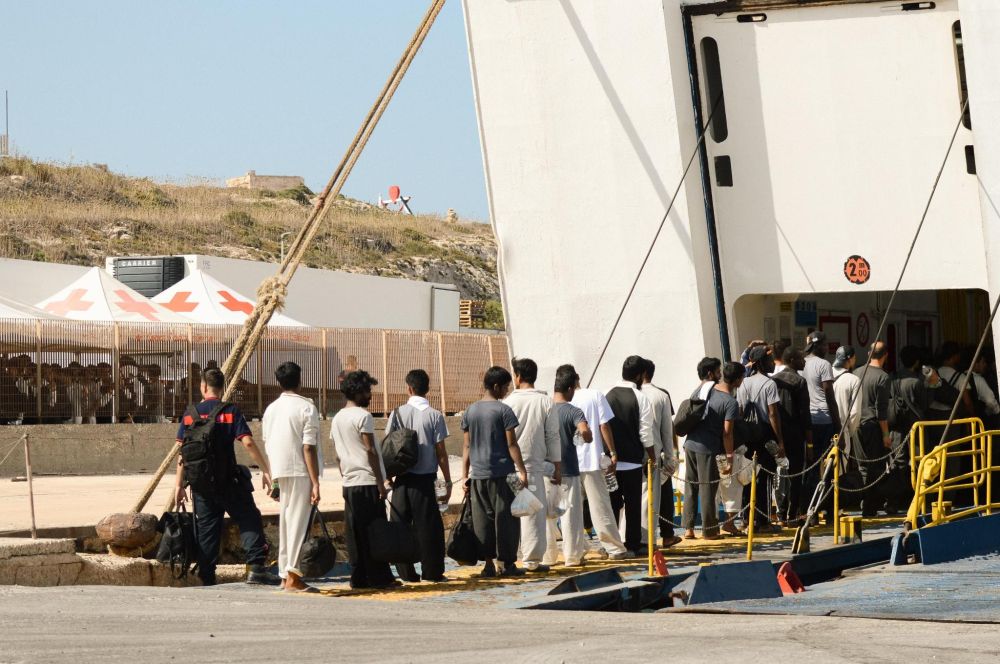 Survivors embark the ferry to Sicily. 