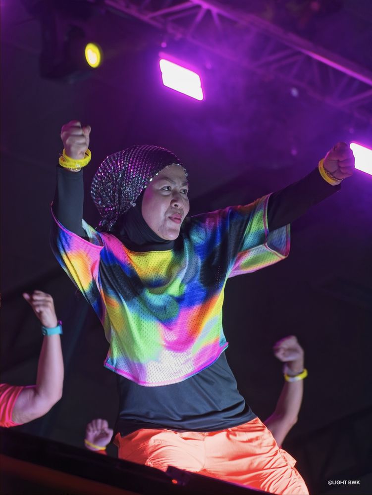 a zoom in shot of one of the Zumba instructor performing