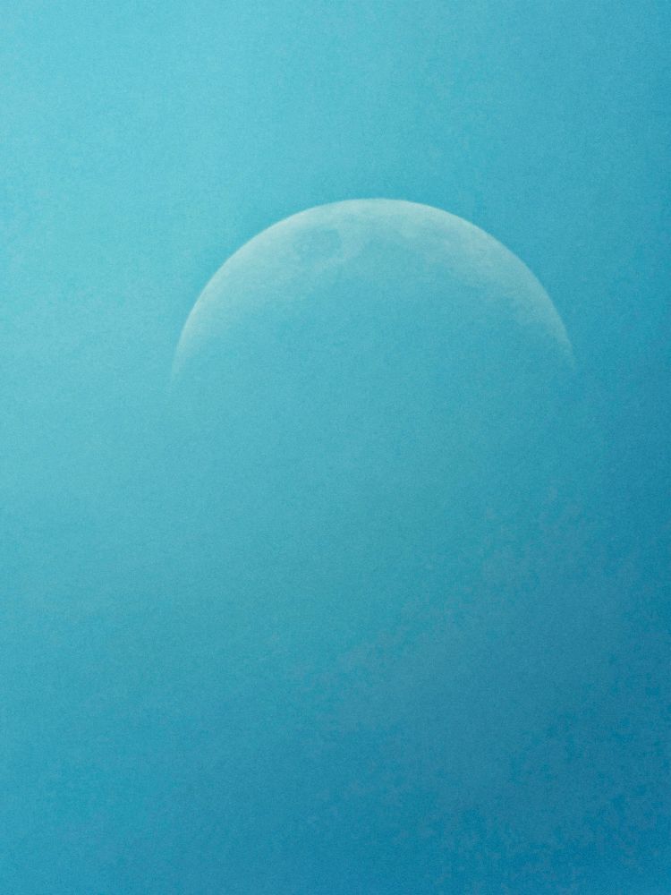 Daytime moon that looks like a death star from Star wars 