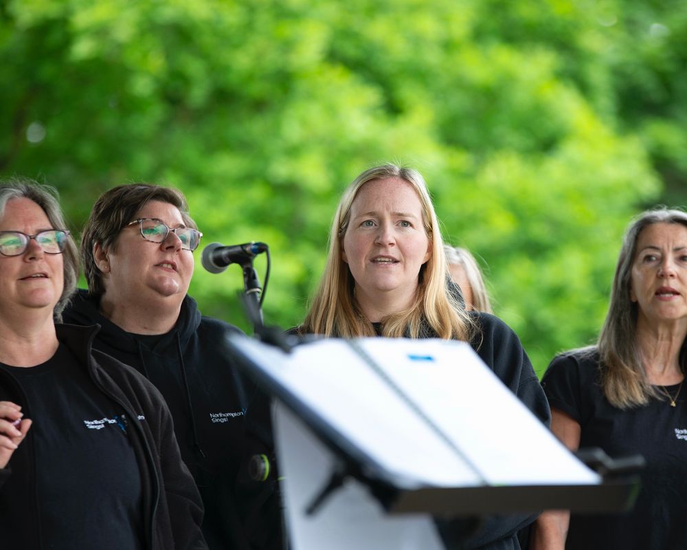 Members a community choir sing 