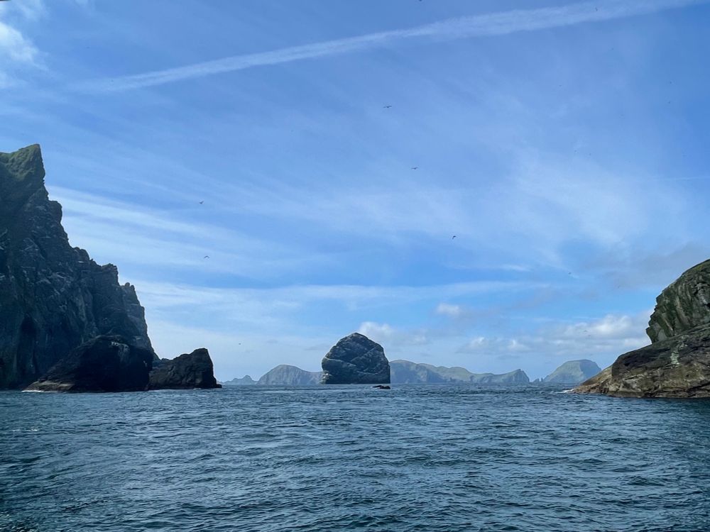 Rocks and islands viewed from an unseen boat as it approaches St Kilda. 