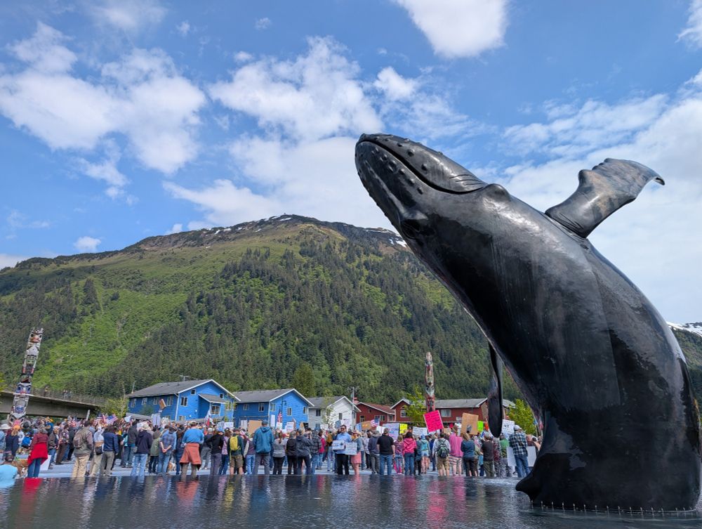 Whale fountain and crowd.