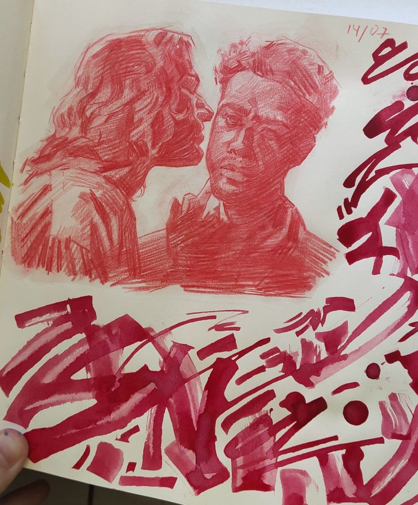 Sketch of Louis and Lestat in red pencil. Around it are chaotic strokes in red ink