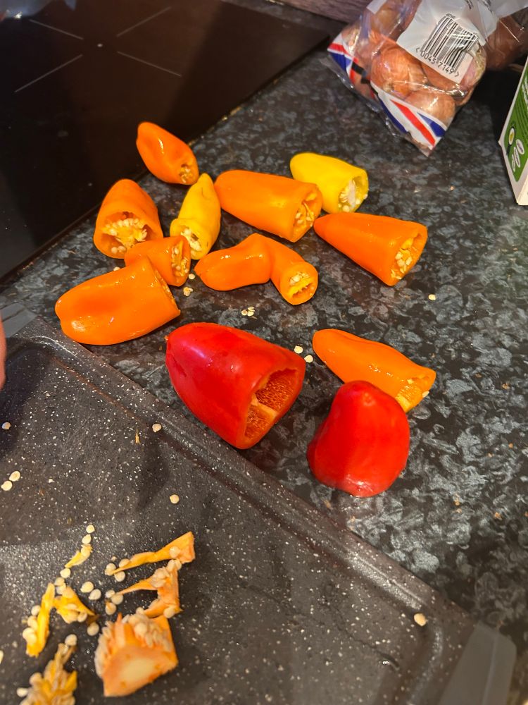 Mixture of sweet peppers having the core cut out.
