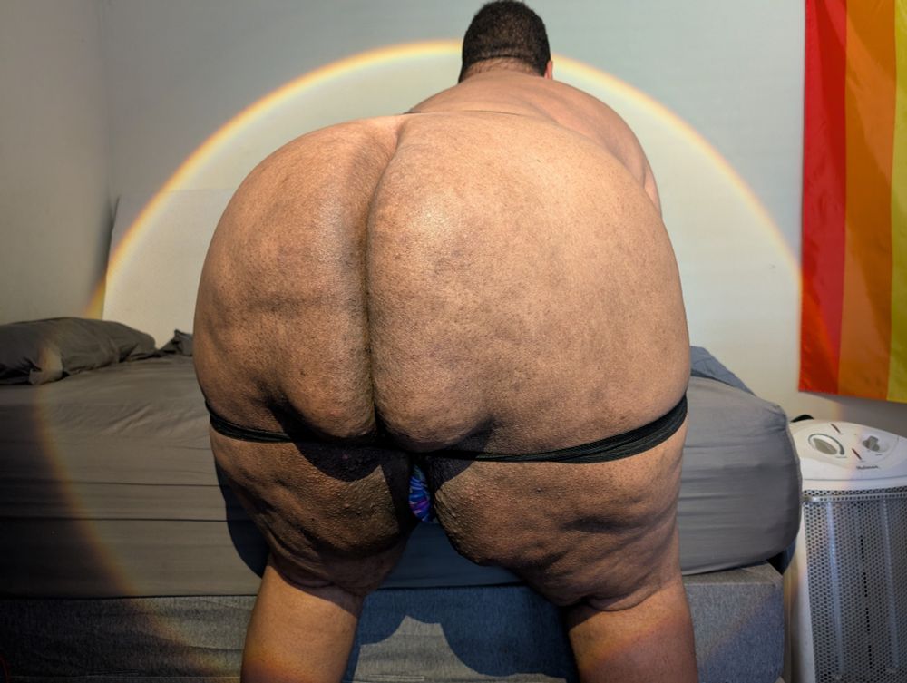 Superchub wearing a jockstrap bent over showing off his massive butt cheeks 