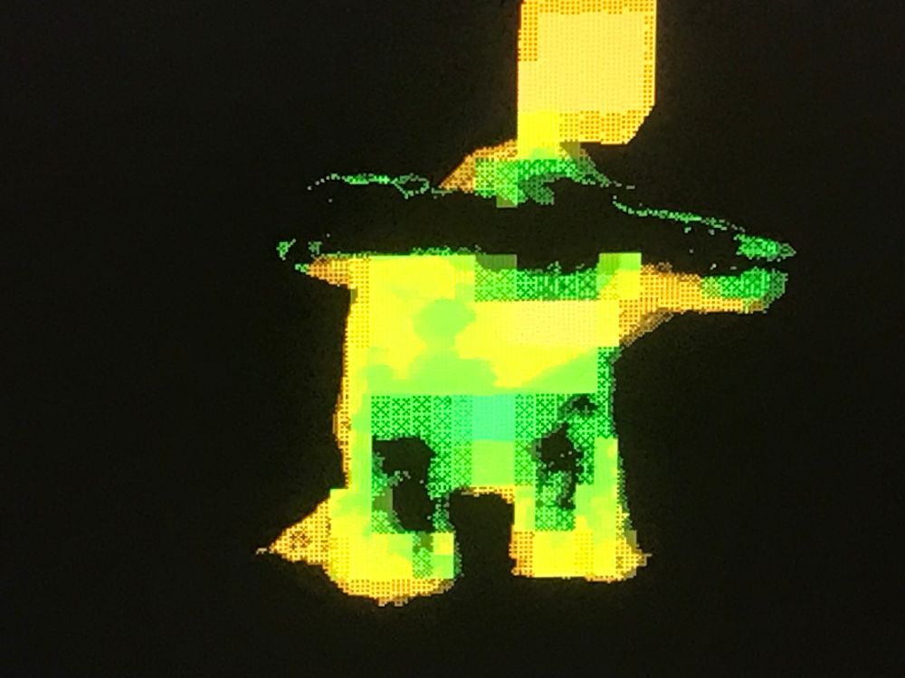 Dithered orange and green against black