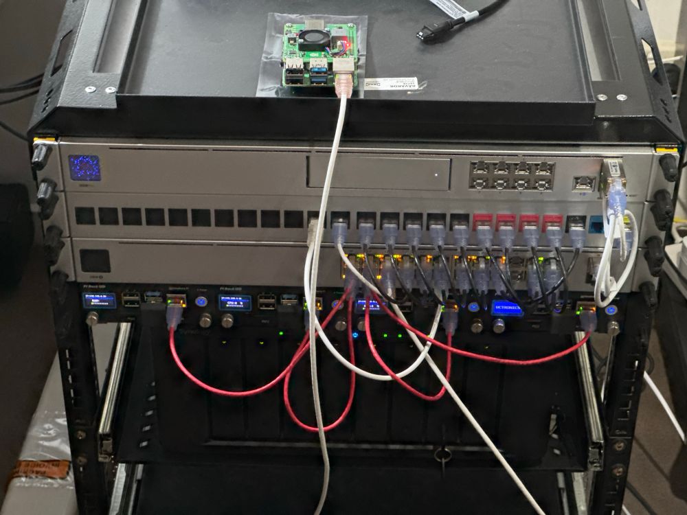 Photo of network and compute equipment in a network rack with cables going everywhere!