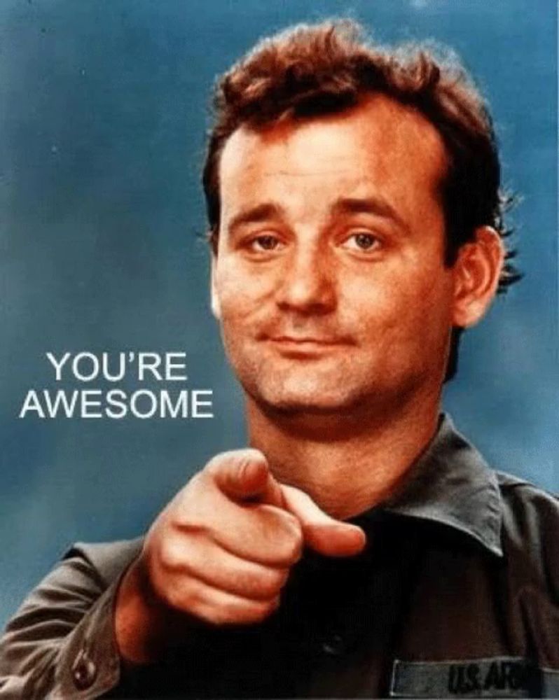 a man pointing at the camera with the words you 're awesome on the bottom