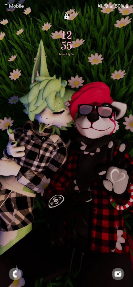 two cool ass bitches (one green and one red) laying in the grass