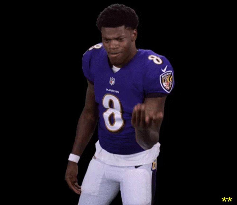 a man in a purple jersey with the number 8 on it is dancing