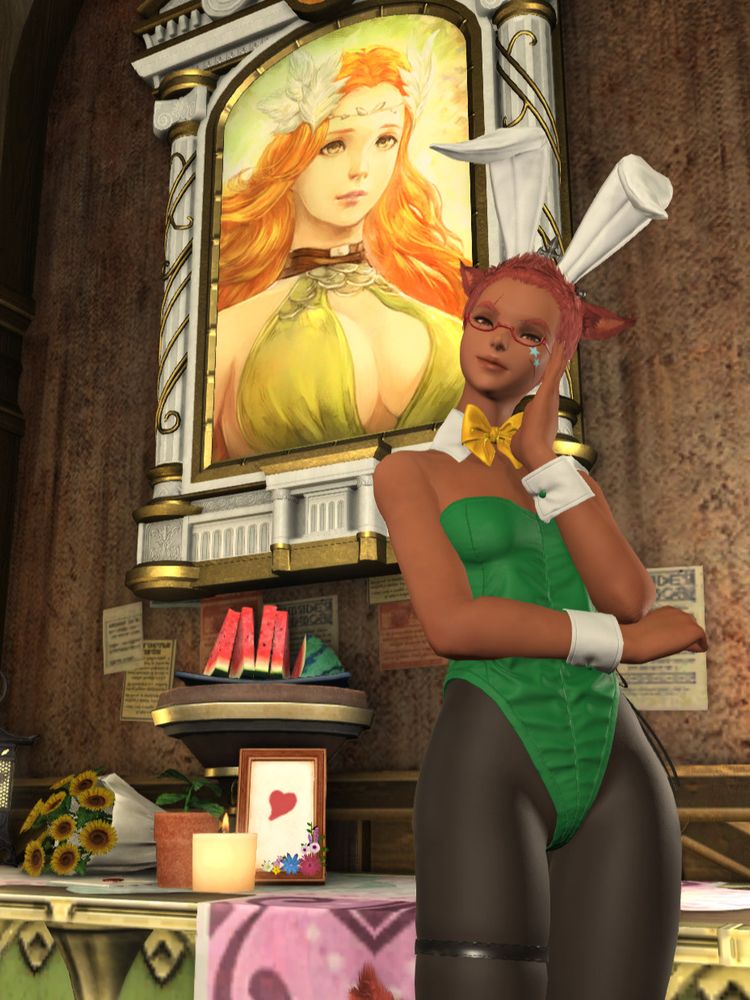 Chu in a green, gold, and white (modded) bunny suit showing off her personal alter to Nophica. Among the offerings are sunflowers, a candle, and a couple big melons (sliced).