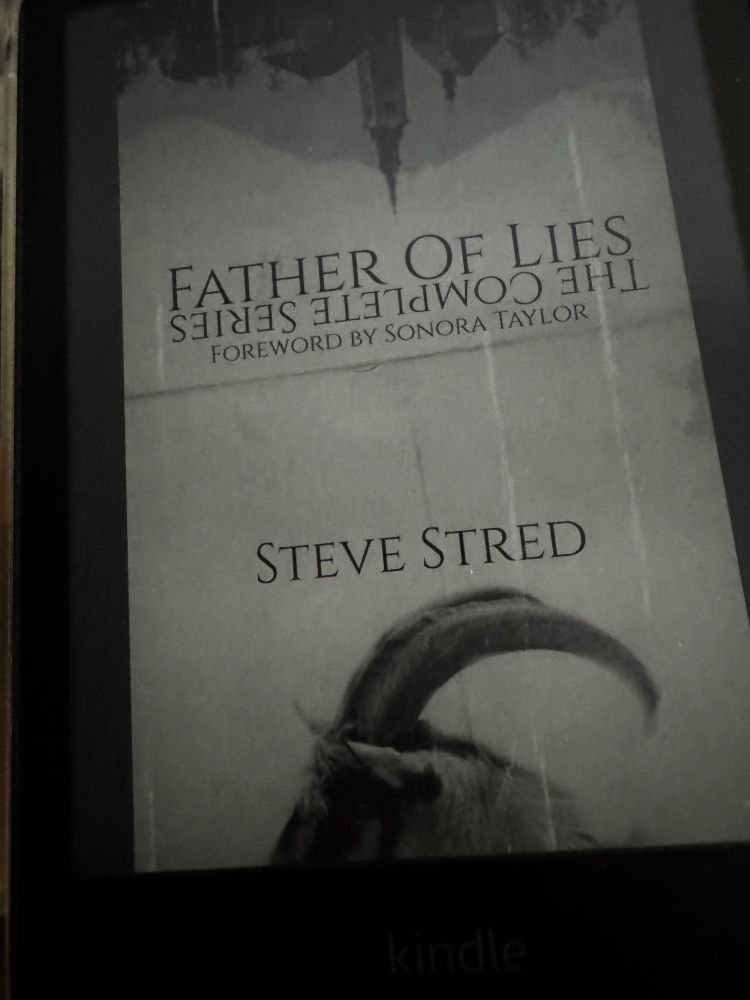 The kindle cover for Father of Lies by Steve Stred featuring an upside down cityscape and a partial goats head with curved horns. 