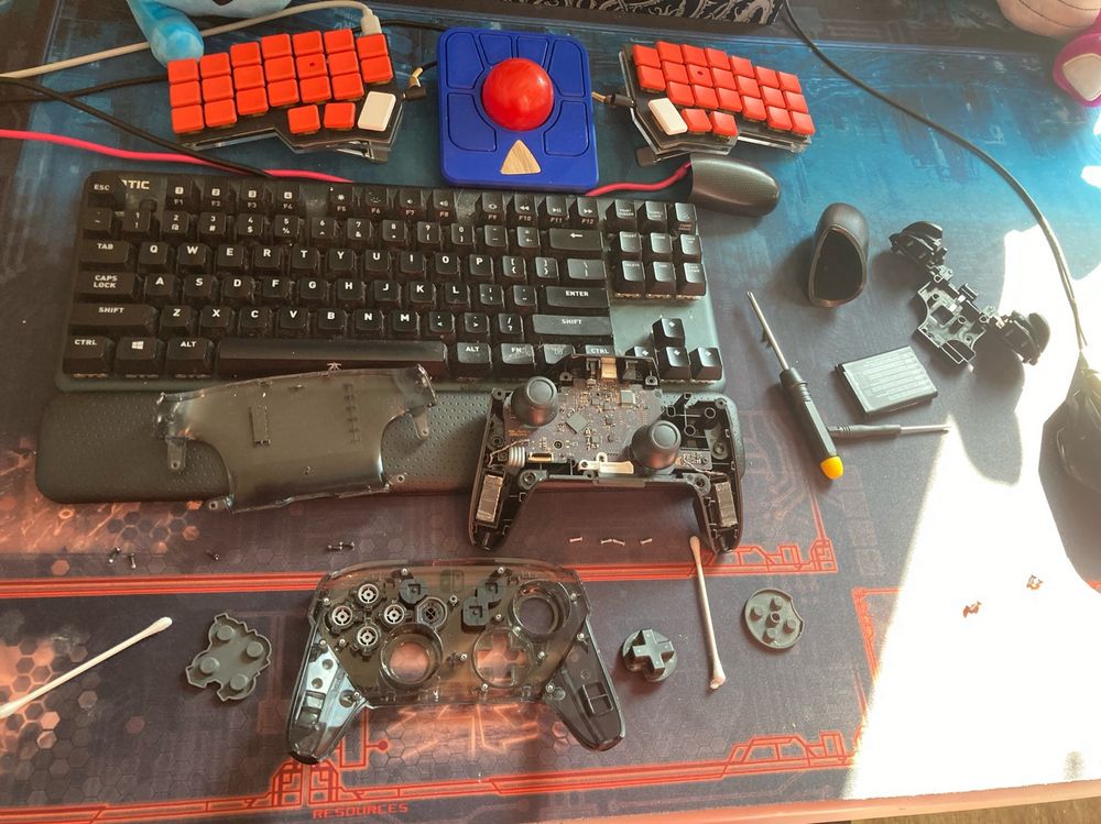 A switch controller, taken apart and spread across my desk 
