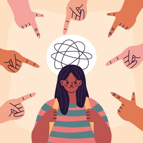 A cartoon of young woman of colour, clearly unhappy, with hands of different colours pointing at her.