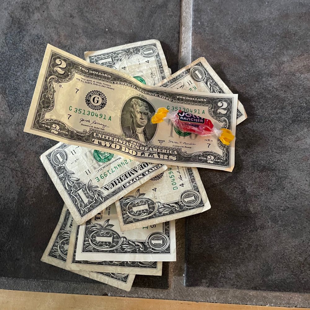 $7 in USD along with a cherry jolly rancher, which is the best flavor so she was down bad last night 