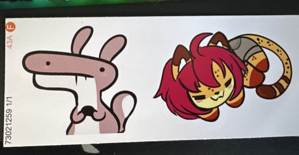 a picture of some cute stickers , a nervous chipmunk and a curled up serval/cheeta cat  
