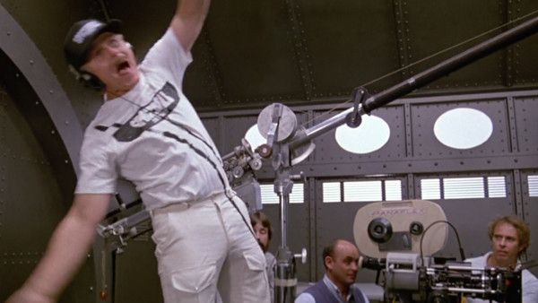 A crewman is injured, breaking the fourth wall, in the 1987 movie Spaceballs.