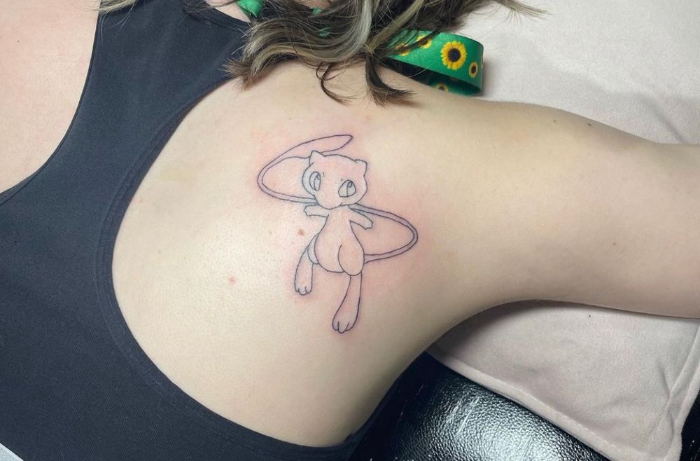 my cute mew pokémon tattoo on my right shoulder blade