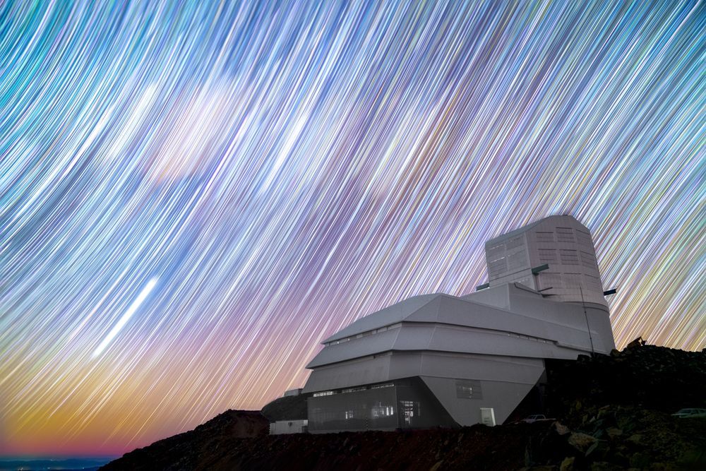 Rubin Observatory stands on Cerro Pachón in Chile against a sky full of star trails in this long exposure night sky image. Credit: Hernan Stockebrand