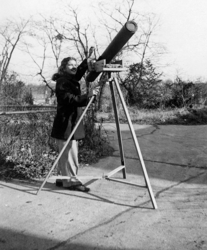 Vera Rubin with her homemade telescope. Rubin's fascination with astronomy began in childhood as she watched the night sky from her bedroom window. She built her first telescope with her father’s help, ordering a small lens from Edmunds Scientific Co. and sourcing a free cardboard tube from a linoleum company. She lugged the large, unwieldy tube home on the bus from downtown, an early sign of the dedication that would define her lifelong pursuit of astronomy. Credit: Carnegie Science