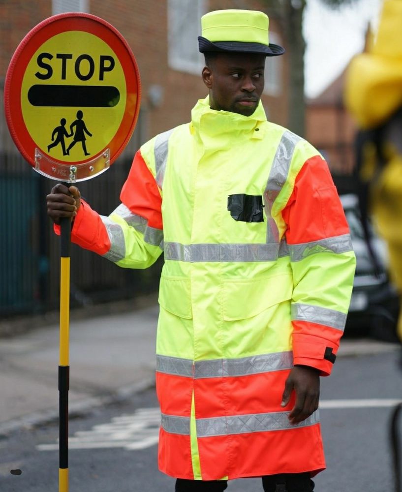Marc Guehi as a lollipop man with sign saying “STOP”