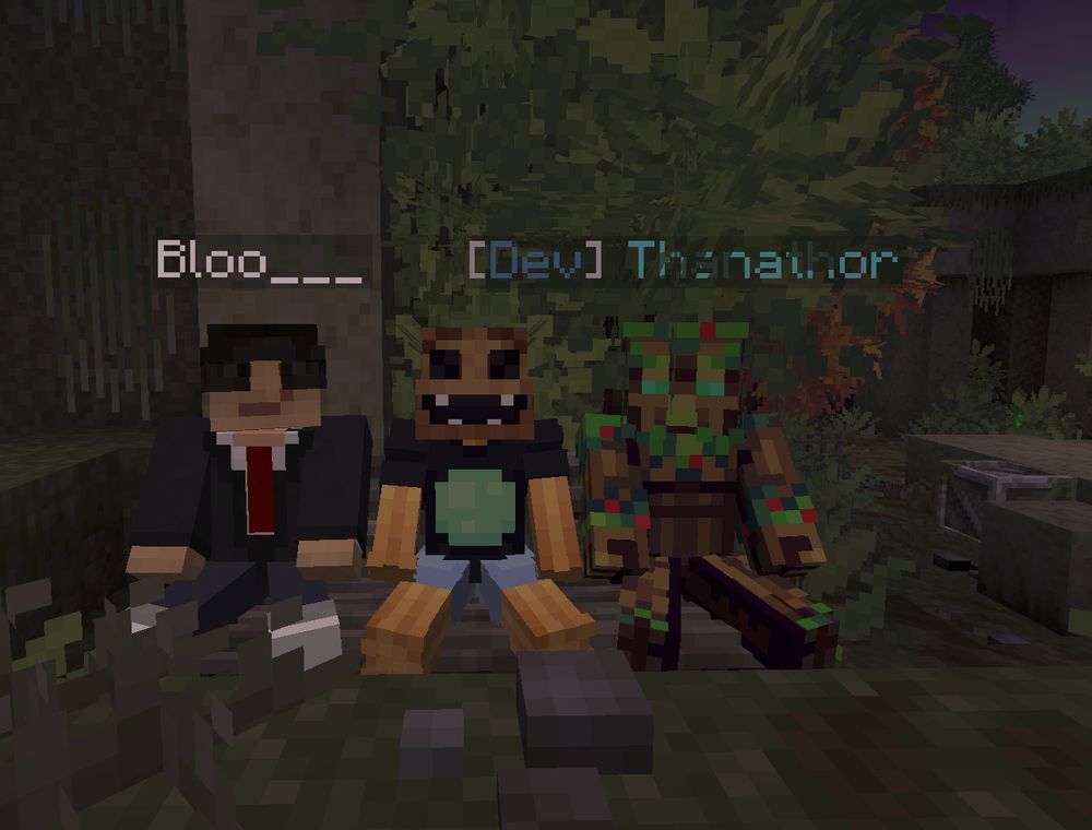 3 Minecraft players sitting on a virtual park bench.