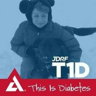 Me with my all black German Shepherd Lab mix in the snow. I am wearing a hat with bear ears. The coloring of the picture is grey shaded" The Juvenile Diabes Research Foundation And the American Diabetes Association symbols are on the banner saying "This is Diabetes" at the bottom of the picture.