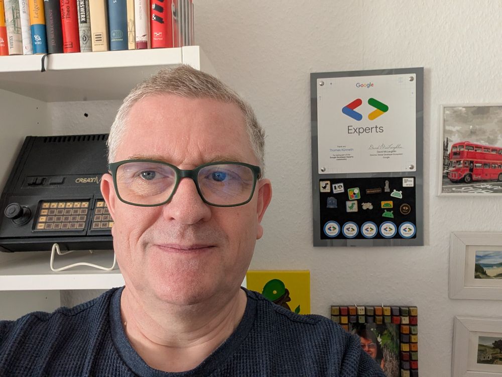 That's me, in front of the GDE pin board. There are 5 GDE pins and a couple of other ones