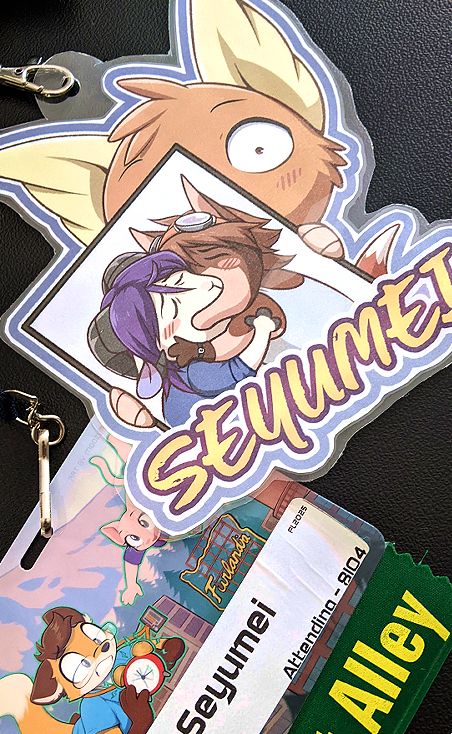 Personal furry badge for Furlandia, plus artist alley badge