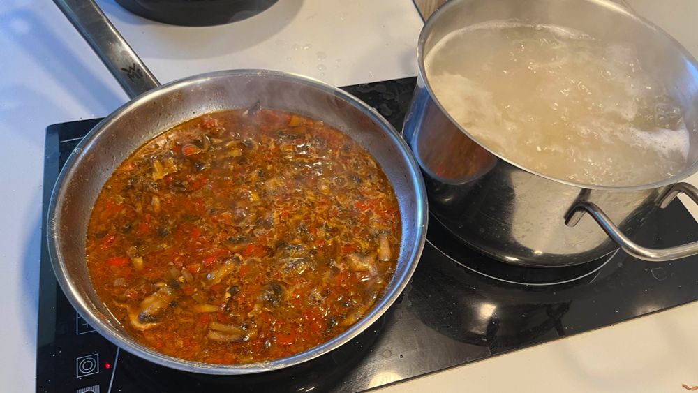Sauce simmering and pasta boiling. 