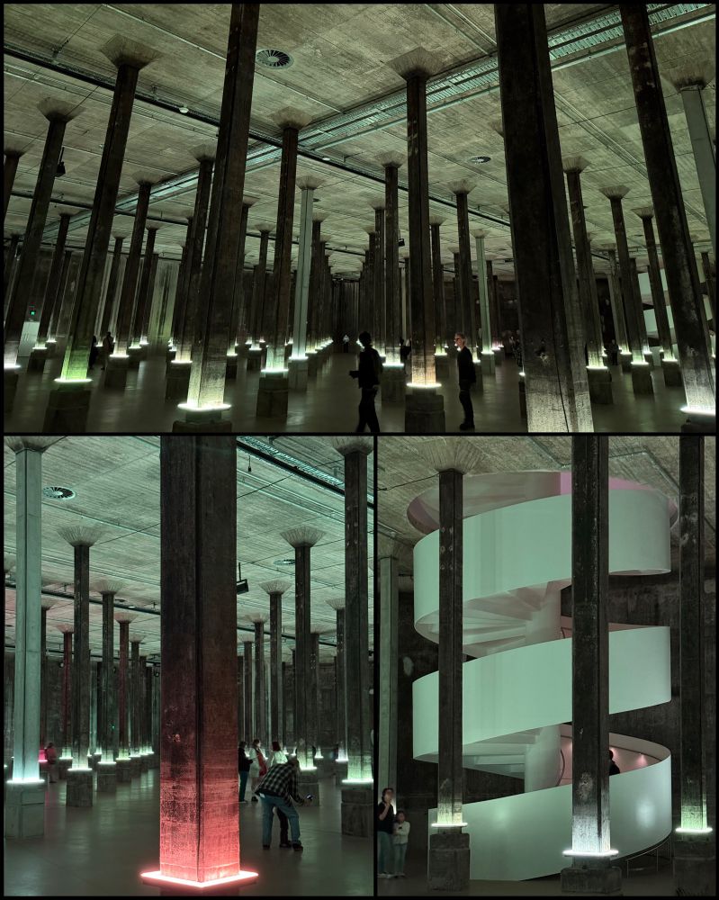 a photo of a vast subterranean tank full of thin columns, lit up mysteriously