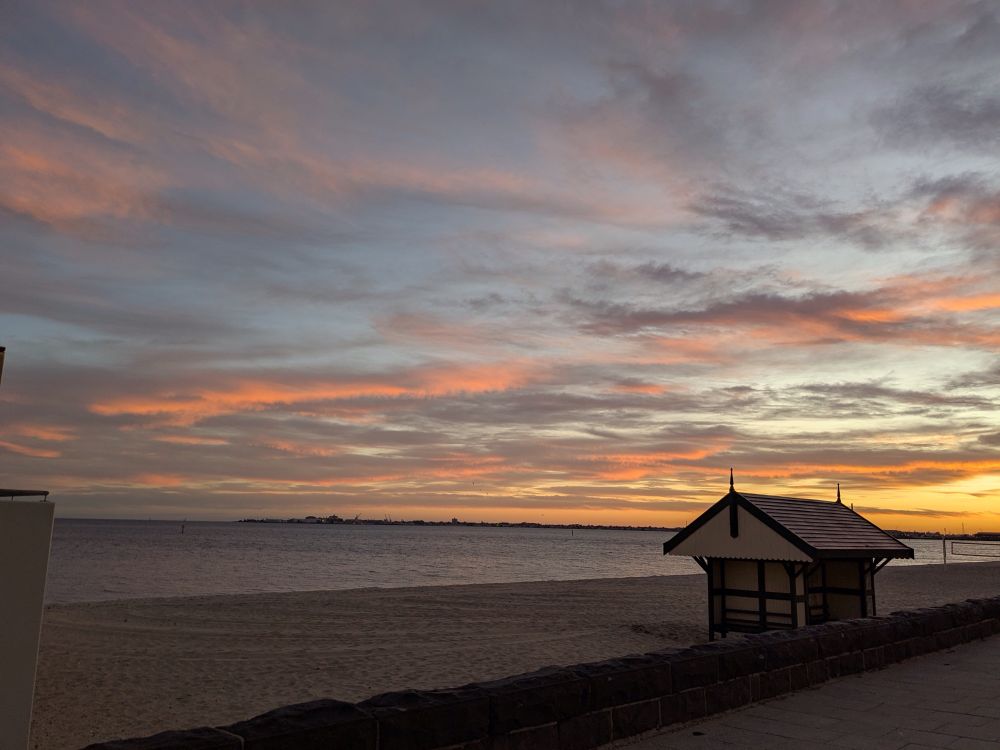 The sun is almost gone - the hut is in the right foreground and beach and ocean are just a glimmer in the fore and middle ground