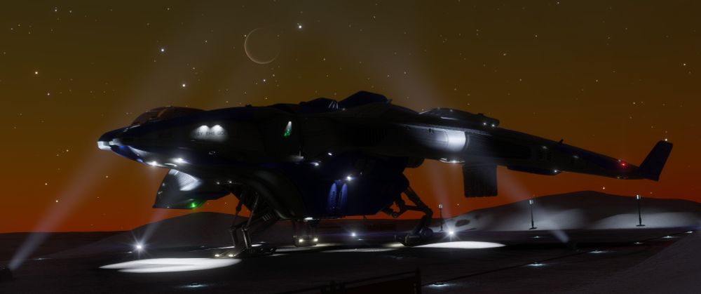 A picture of the Mandalay space ship landed at a planetary starport taken low from the ground in the evening with a deep orange glow on the horizon. 