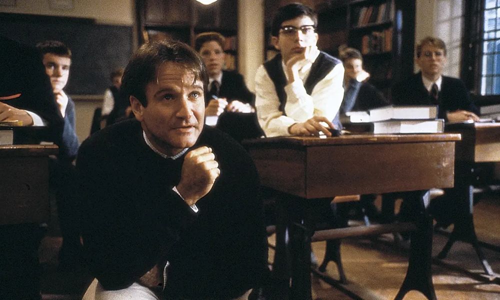 Robin Williams as Mr. Keating in Dead Poets Society and his students.