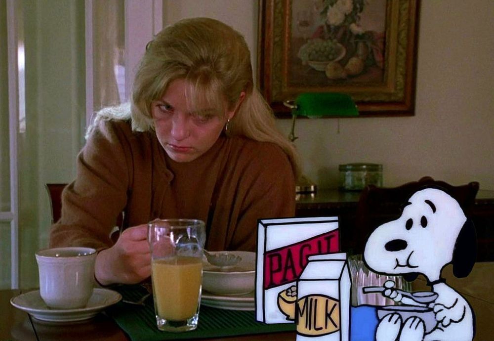 Laura Palmer eating breakfast with Snoopy