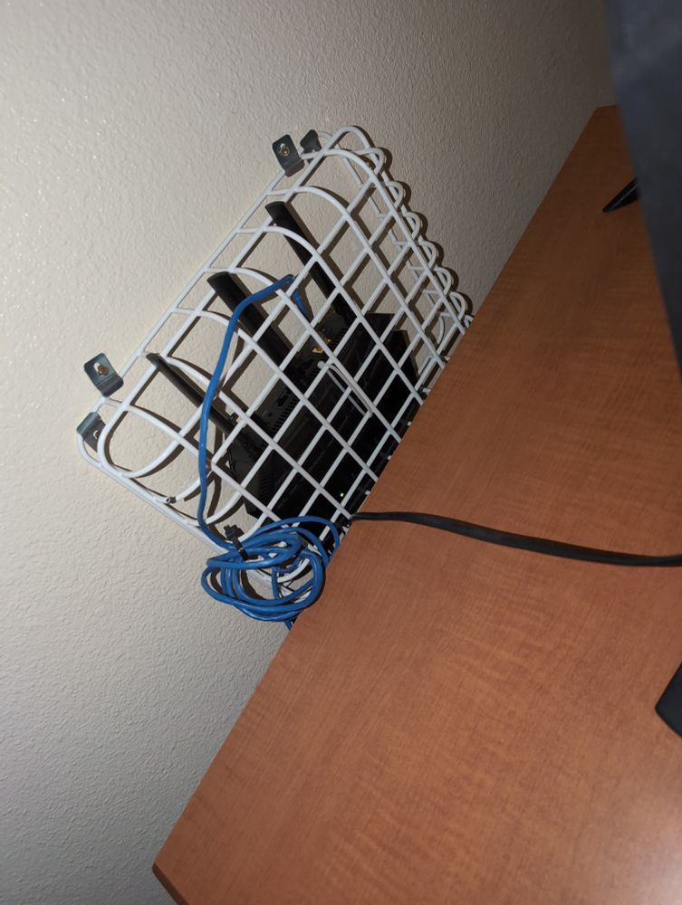 A router locked inside of a cage in my hotel room