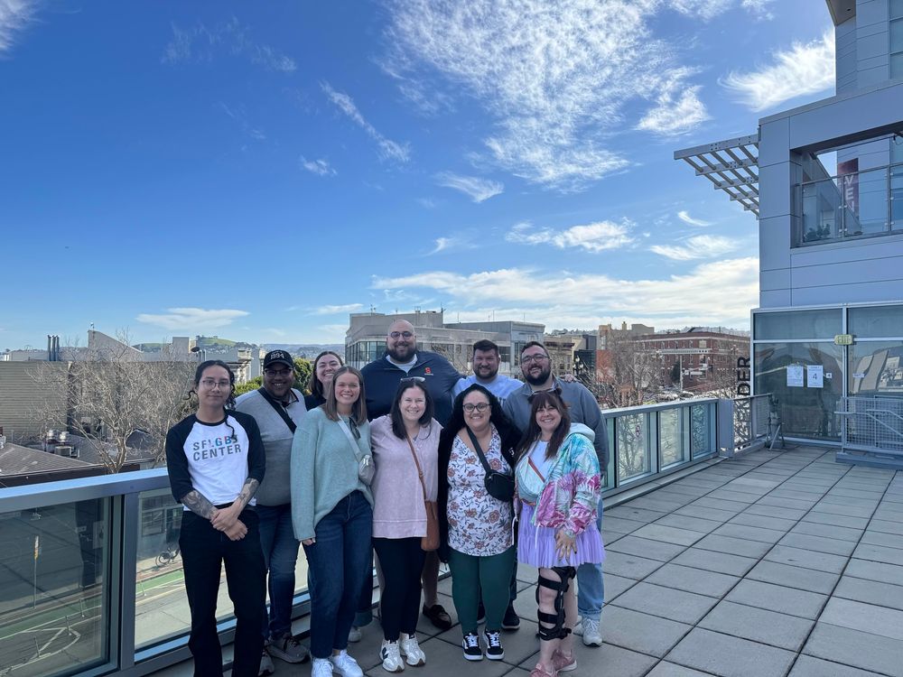 Group photo in front of the San Fran Skyline 
